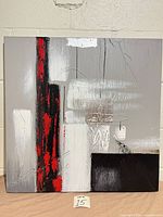 Front view of abstract canvas vertical orientation showing red and black stripe detail