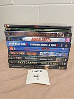Stack of ten DVD cases showing spines and titles
