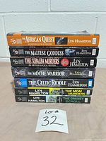 Front view of all seven book spines with titles visible