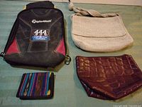 All four items laid out: TaylorMade shoe bag, crochet purse, faux croc pouch, woven wallet