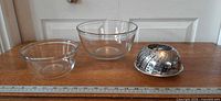 Both glass bowls and steamer with yardstick for scale