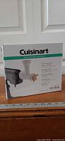 Front of retail box showing Cuisinart Pasta Extruder Attachment