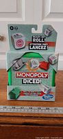 Front of sealed Monopoly Diced! box showing branding and dice graphics