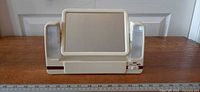 Front view of lighted swivel makeup mirror showing mirror, side lights, drawer