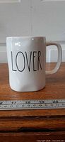 Front view of mug showing "LOVER" text