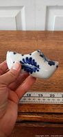 Side view of ceramic clog showing blue floral design
