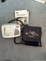 Monitor unit, adult cuff, instruction manual visible