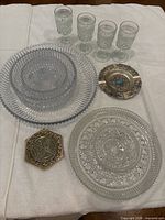 Full lot: four goblets, three nesting bowls, platter, ashtray, trivet