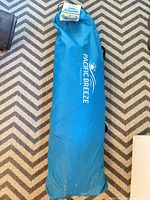 Blue Pacific Breeze carry bag on floor