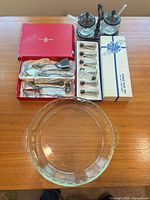 Overall lot: utensil box, salt shaker box, condiment set, glass pie dish