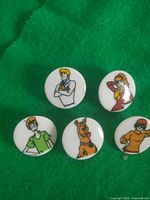 Front view showing five of the character buttons