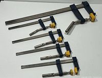 All five Mastercraft F-style bar clamps laid out