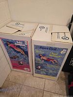 Two sealed Aqua Cell Aqua Hammock boxes side by side