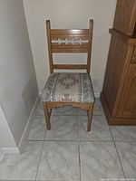 Wood dining chair showing star cutouts and southwest fabric seat