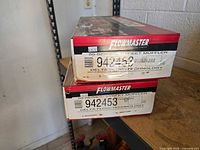 Two stacked Flowmaster boxes showing brand, series and part number label 942453