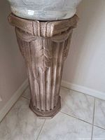 Full view of pedestal showing fluted shaft and octagonal base