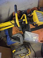 Top view showing yellow framed shop light on top of bags