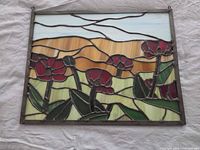 Front view of full stained glass panel showing design and condition