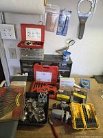 Overall view of lot on workbench showing all included tools and accessories