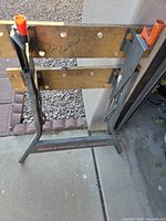 overall front view of folded Workmate showing wood jaws and plastic bench dogs