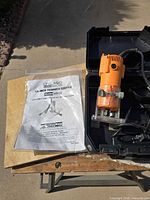 Router, manual and case displayed