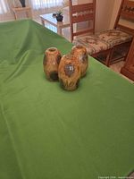 three amber crackle glass shades grouped on table
