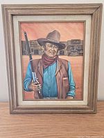 Front view of framed western cowboy portrait artwork