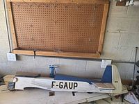 Full view of wooden airplane fuselage with F-GAUP marking