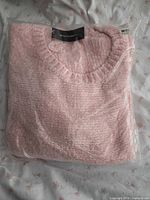 Front view of sealed pink Lord & Taylor sweater