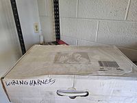 Closed cardboard box labeled Wiring Harness