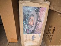 Front of sealed box displaying Classic Firepit image and product details