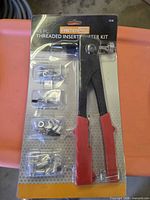 Front of sealed FastenPro 45-pc threaded insert riveter kit showing tool and inserts