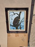 Overall view of framed bear cub artwork showing image, mat and frame