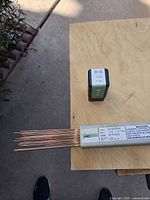 ProStar tube of copper-coated welding rods and separate green R45 1/16 in tube
