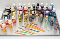 Full tray showing paints, Mod Podge bottles and brushes