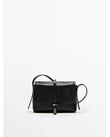 Front view of black leather crossbody bag with flap and strap closure