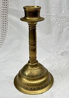 Front view of brass candlestick showing overall design