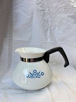 Side view showing Blue Cornflower motif, handle, overall shape