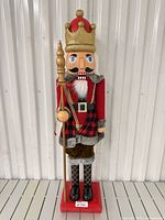 Front view full-length of nutcracker with base and staff