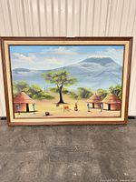Full view of framed painting showing entire artwork and frame
