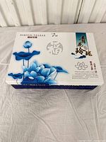 Closed presentation box with lotus design