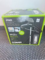 Factory box showing Conair Ultimate Fabric Steamer branding and specs