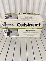 Front of sealed Cuisinart CMG-100C meat grinder retail box