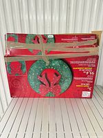 Two taped retail boxes of Home Accents Holiday 3 ft Colour-Changing LED Wreath