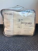 Front view of sealed Jacquard comforter set package