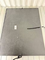 closed black portfolio case with ties