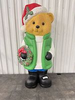 Full front view of 35" plastic bear figurine unlit