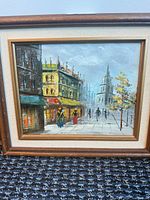 Full view of framed oil painting showing artwork, frame, and mat