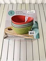 Front of box showing stacked bowl colors and capacity