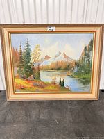 Framed mountain landscape oil painting front view